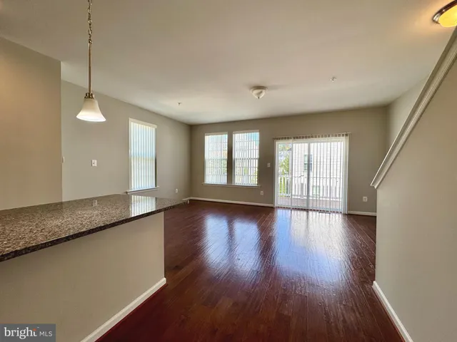 a bathroom with a shower sink vanity mirror and toilet