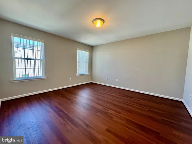 a white toilet sitting next to a bath tub