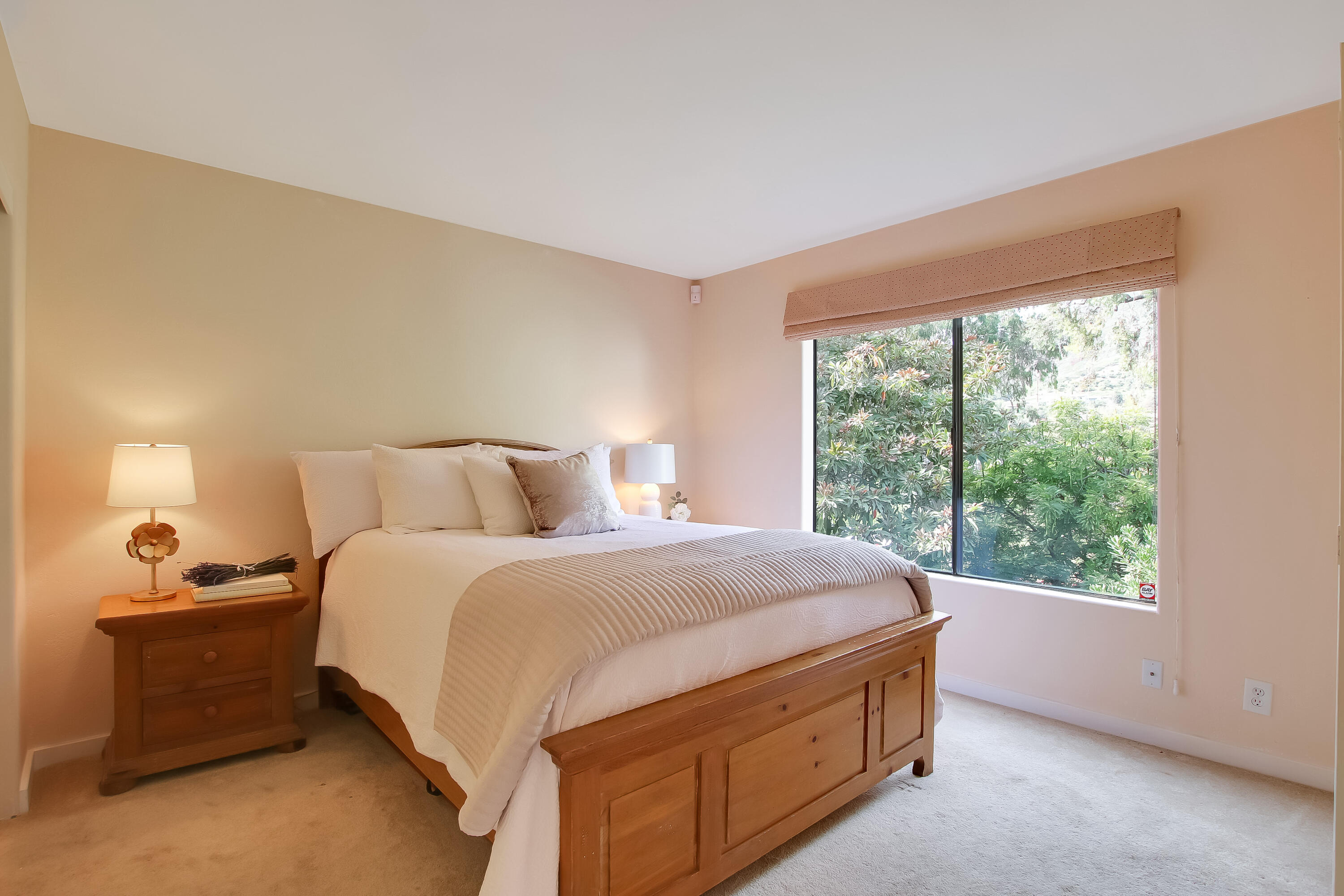3375 Foothill Road, Unit 333 Carpinteria, CA 93013 - Photo 15 of 23 a bed sitting in a bedroom next to a window