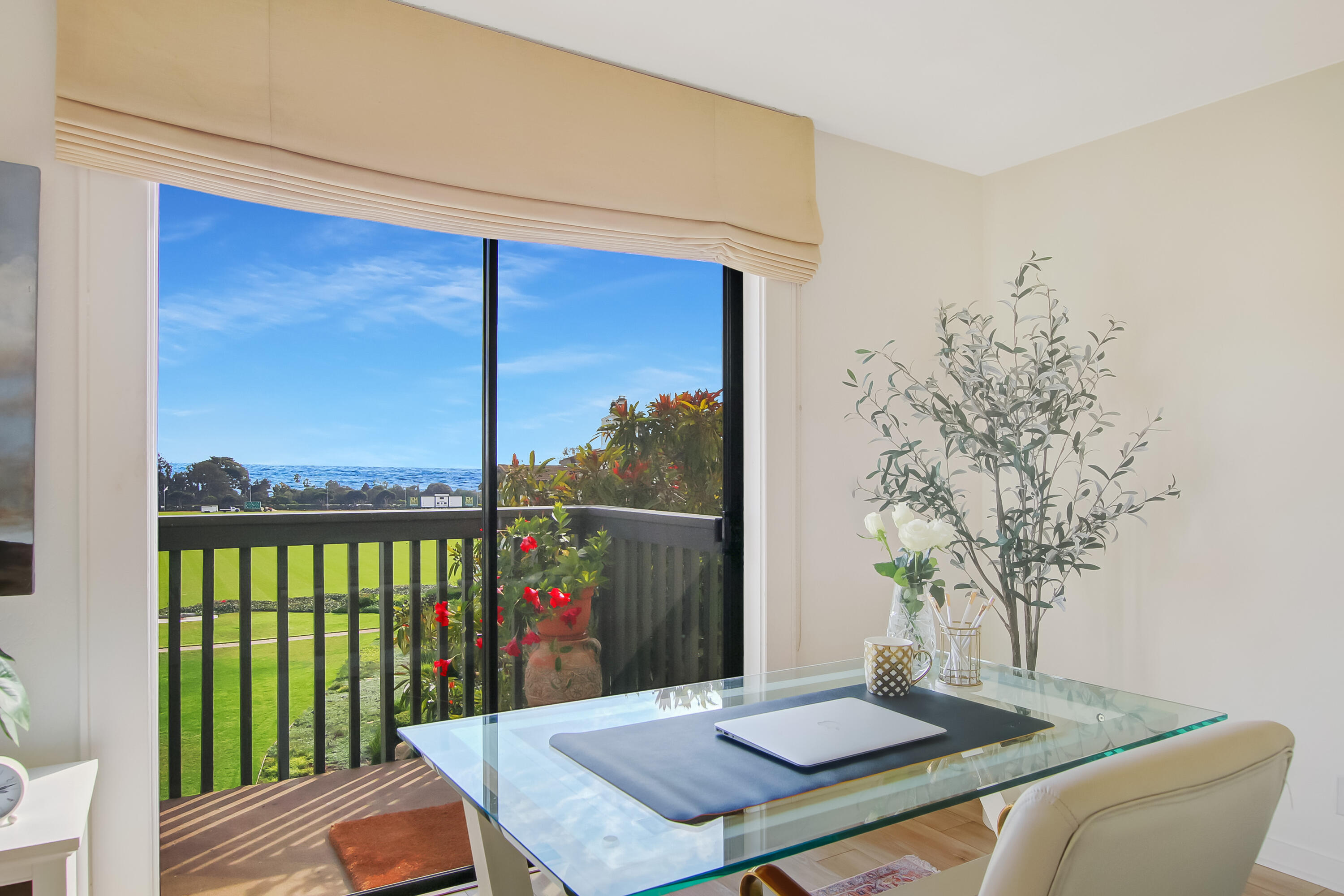3375 Foothill Road, Unit 333 Carpinteria, CA 93013 - Photo 6 of 23 a view of a balcony with a table and chairs
