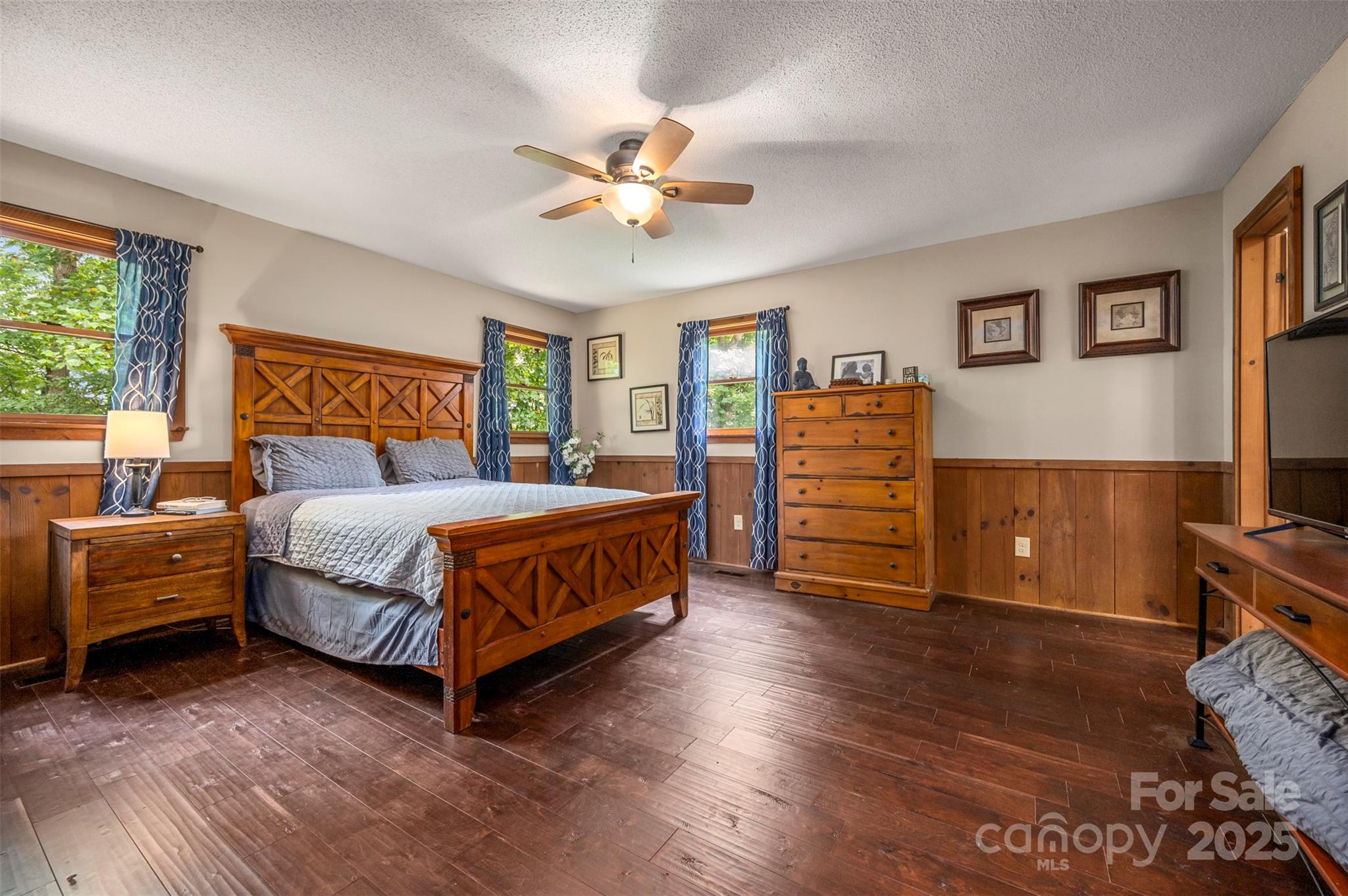 307 Owl Hollow Road Mill Spring, NC 28756 - Photo 15 of 31 a bedroom with a bed and a cabinets