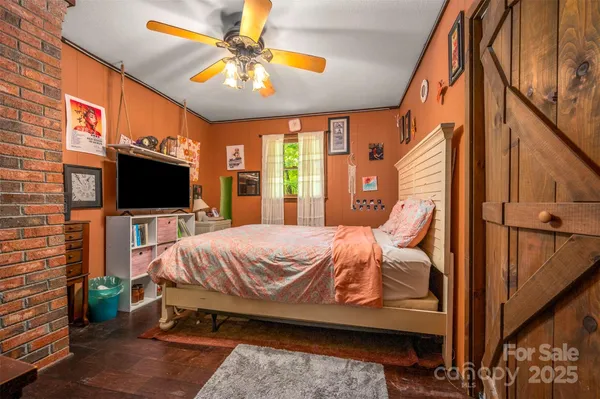 a bed sitting in a room next to a window