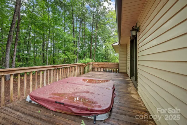 a view of balcony with wooden floor and outdoor seating