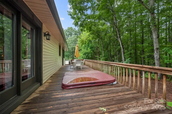 a view of balcony with wooden floor and outdoor seating