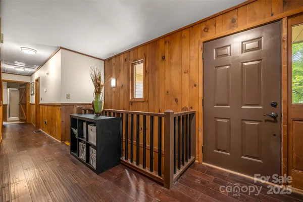 a view of a hallway with entryway door