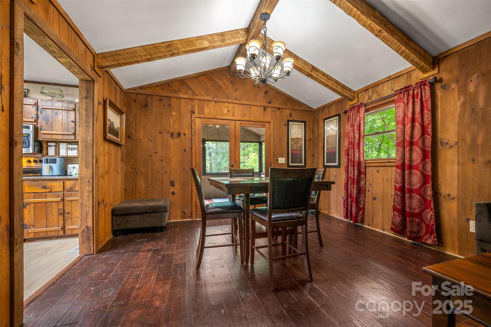 307 Owl Hollow Road Mill Spring, NC 28756 - Photo 10 of 31 a view of a dining room with furniture window and wooden floor