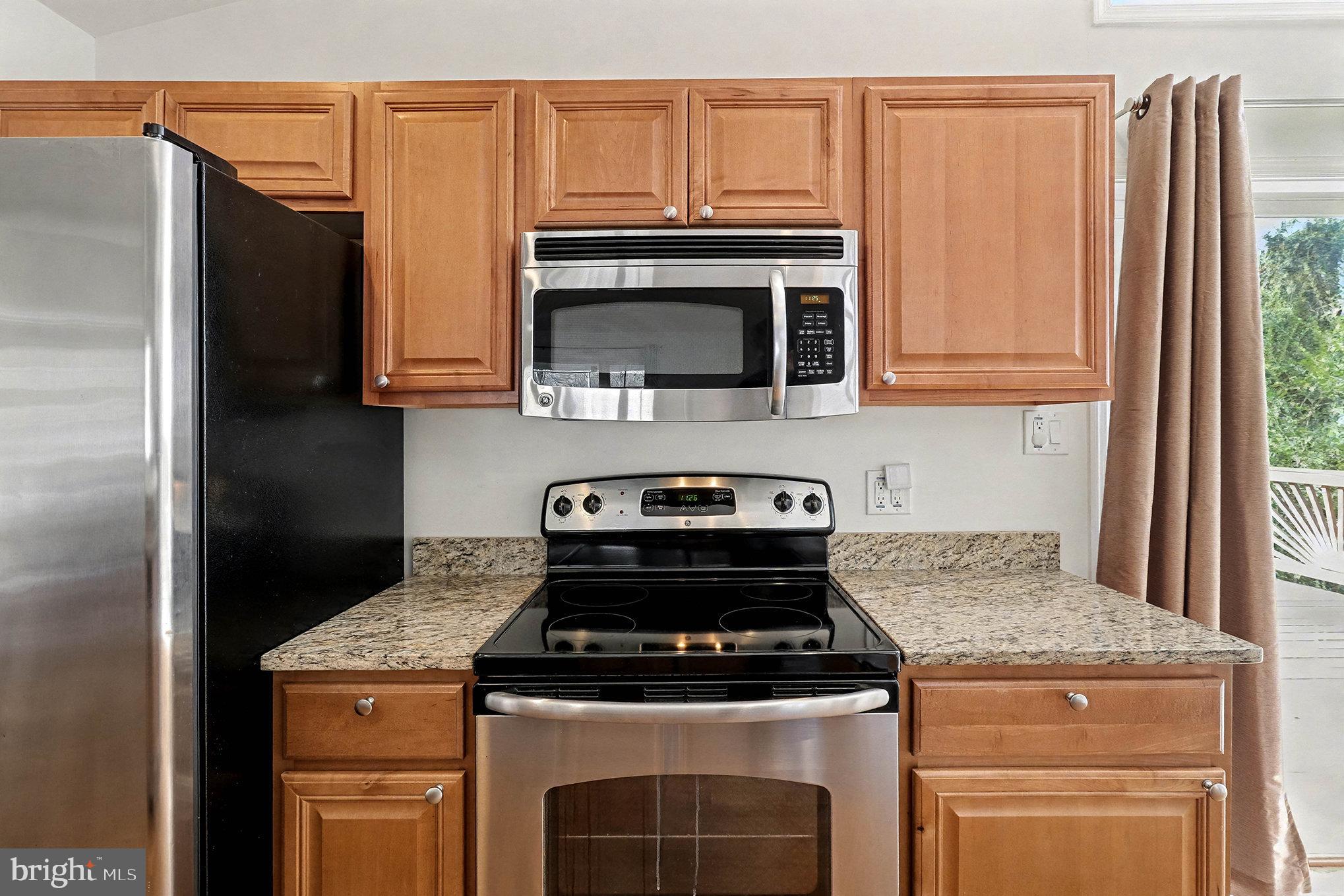 18316 Cabin Road Triangle, VA 22172 - Photo 12 of 42 a stove top oven sitting inside of a kitchen