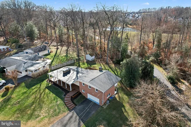 a view of a small house in the forest