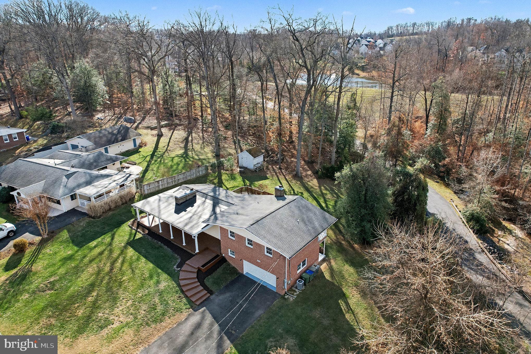 18316 Cabin Road Triangle, VA 22172 - Photo 2 of 42 a view of a small house in the forest