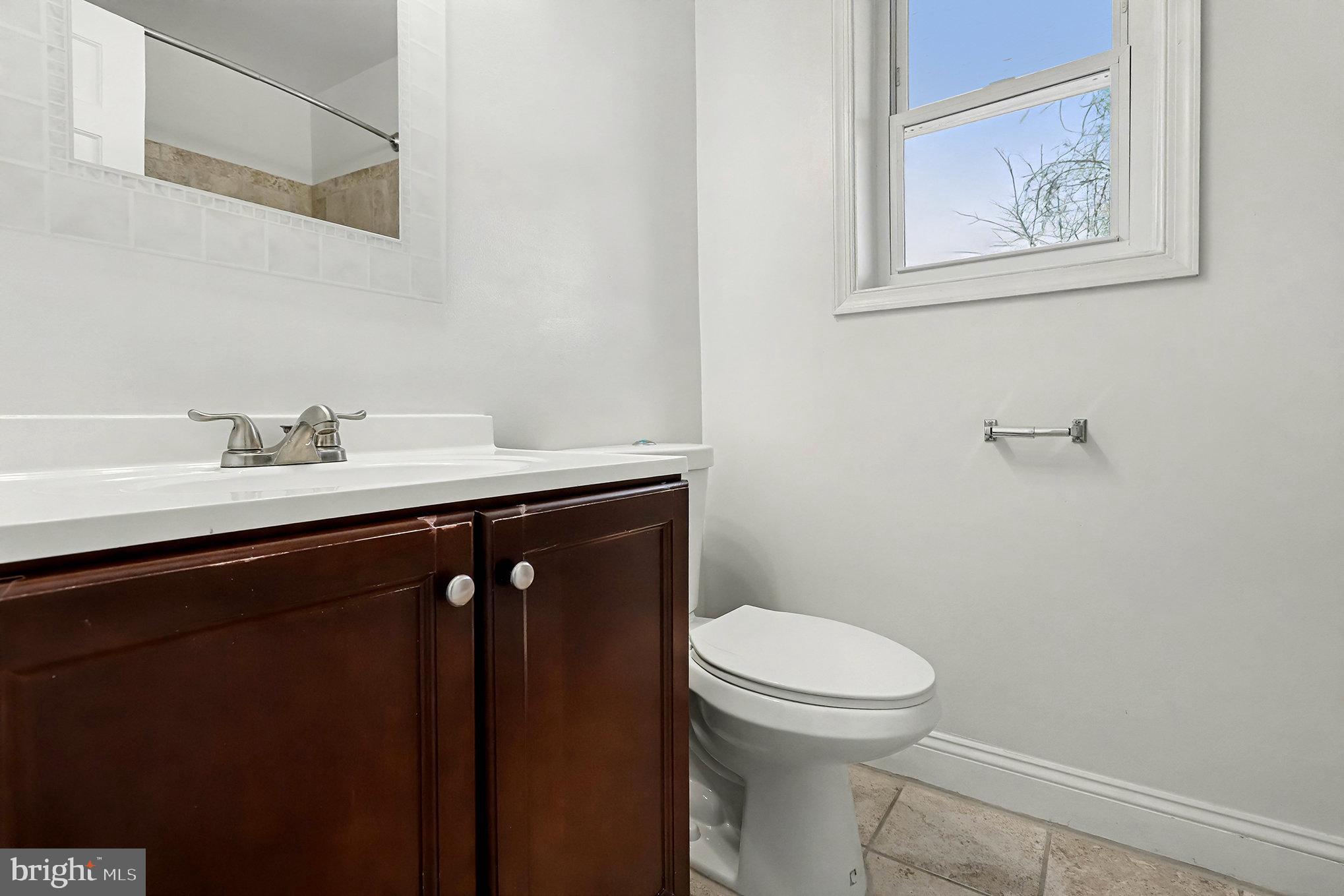 18316 Cabin Road Triangle, VA 22172 - Photo 22 of 42 a bathroom with a sink and a toilet