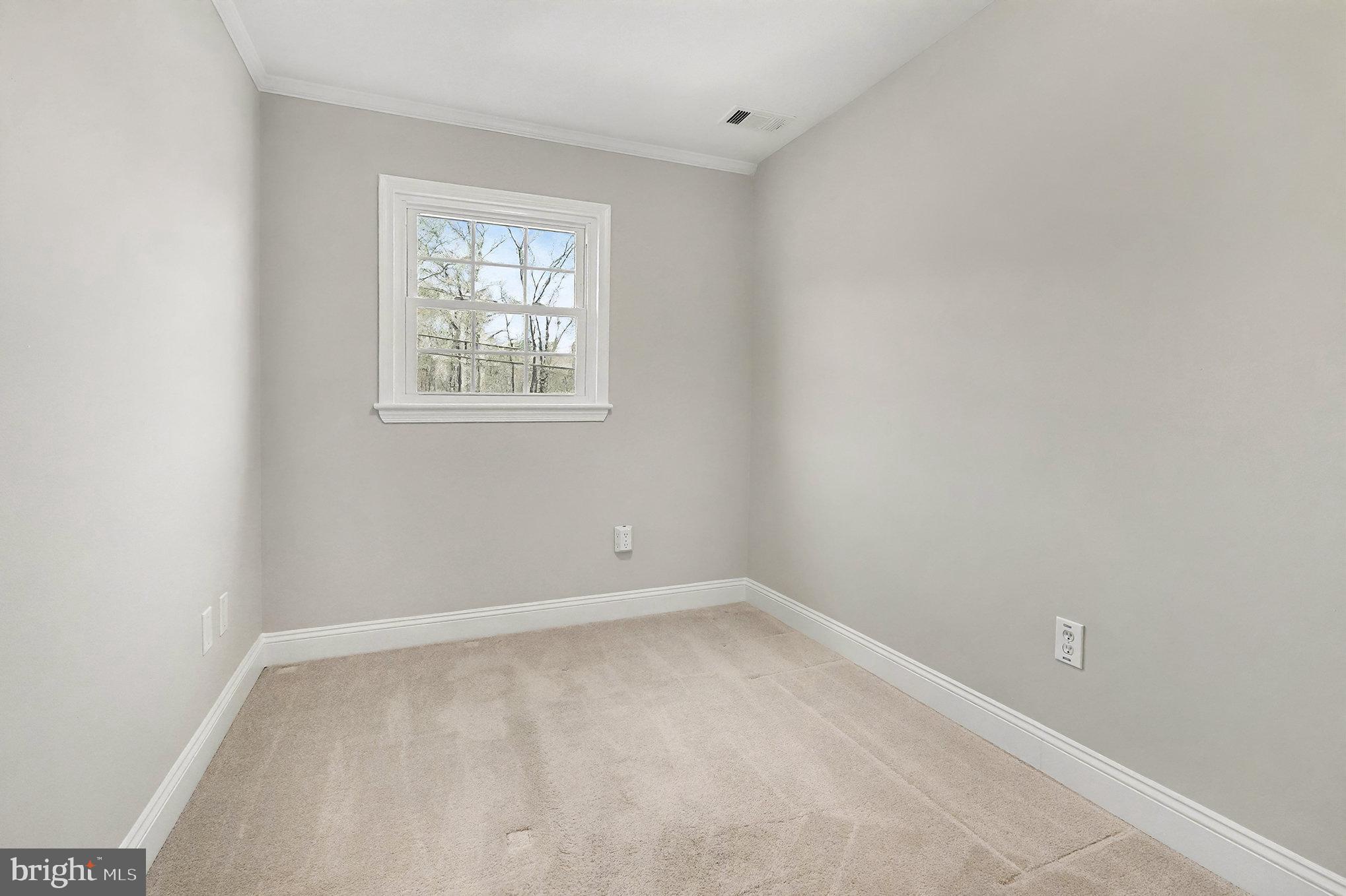18316 Cabin Road Triangle, VA 22172 - Photo 24 of 42 an empty room with a window