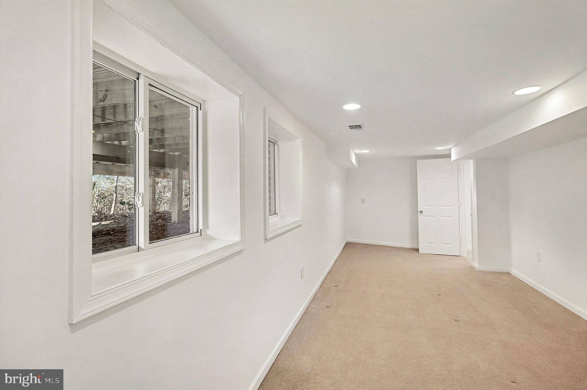 18316 Cabin Road Triangle, VA 22172 - Photo 28 of 42 a view of an empty room with a window