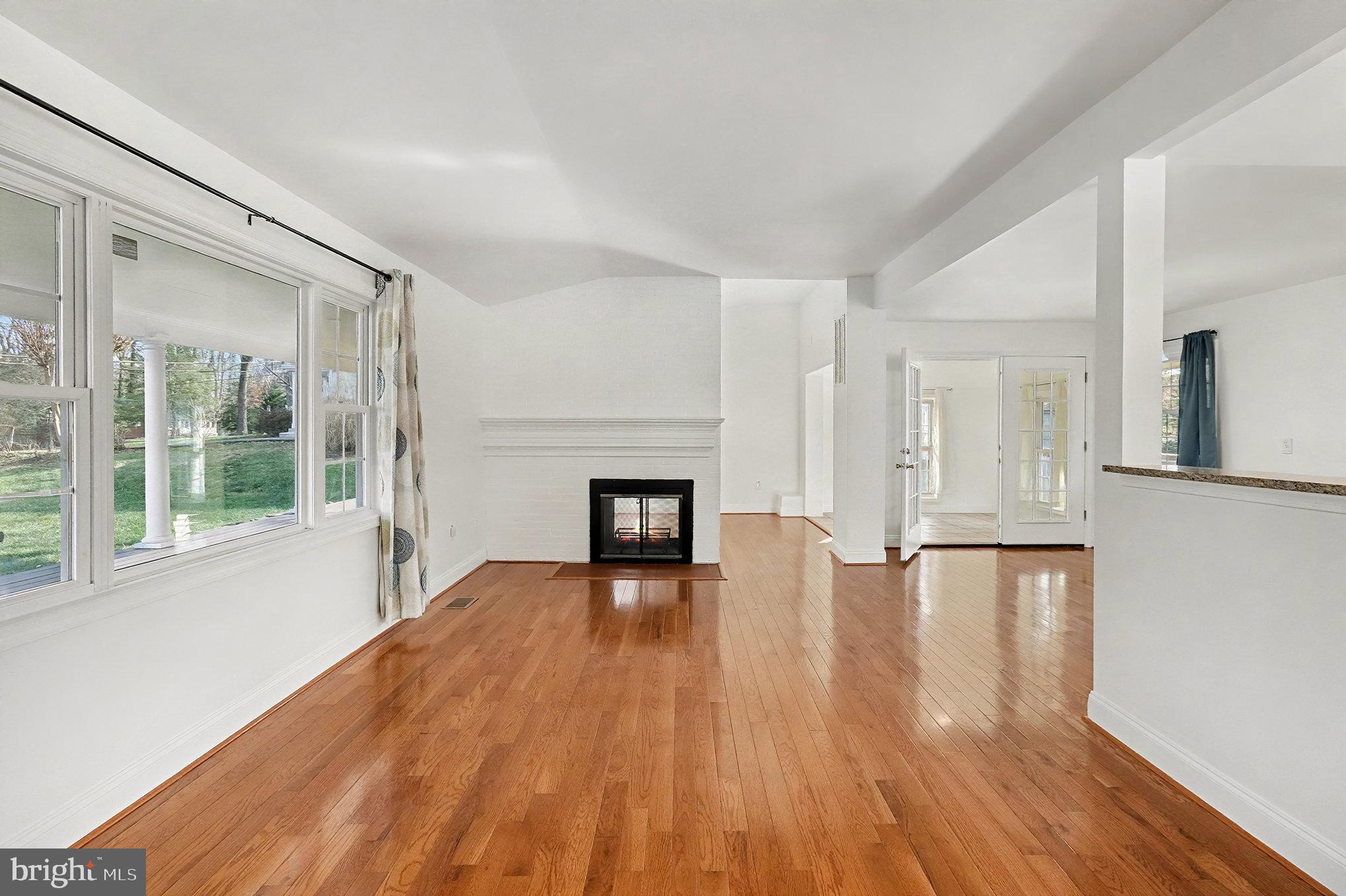 18316 Cabin Road Triangle, VA 22172 - Photo 6 of 42 a view of a room with wooden floor and fireplace