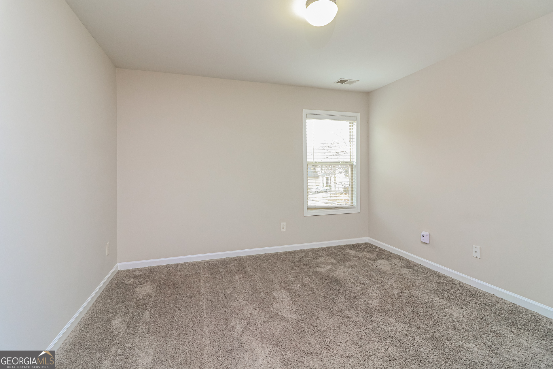 2570 Kolb Manor Circle Southwest Marietta, GA 30008 - Photo 16 of 22 an empty room with a window