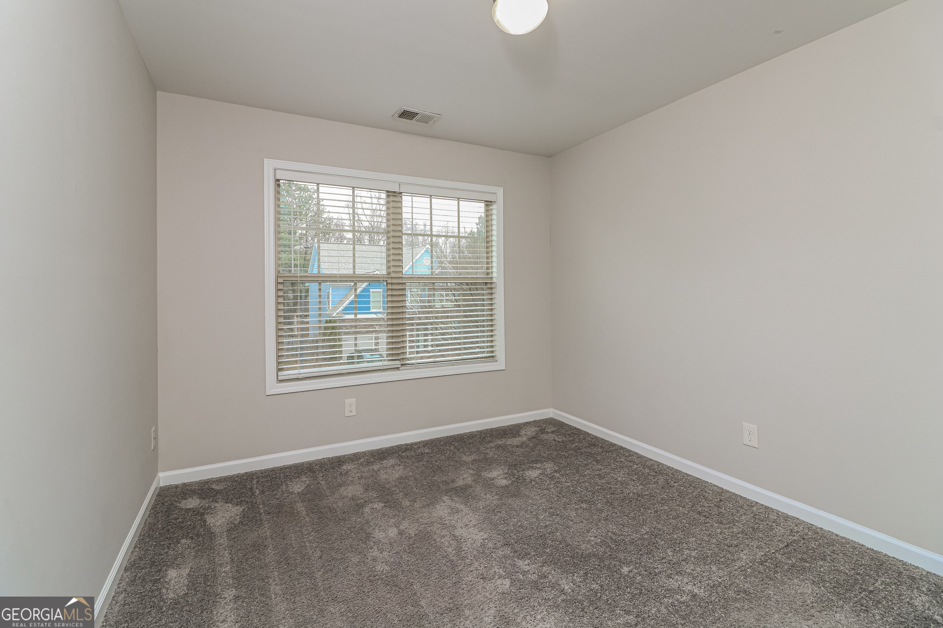 2570 Kolb Manor Circle Southwest Marietta, GA 30008 - Photo 17 of 22 an empty room with a window