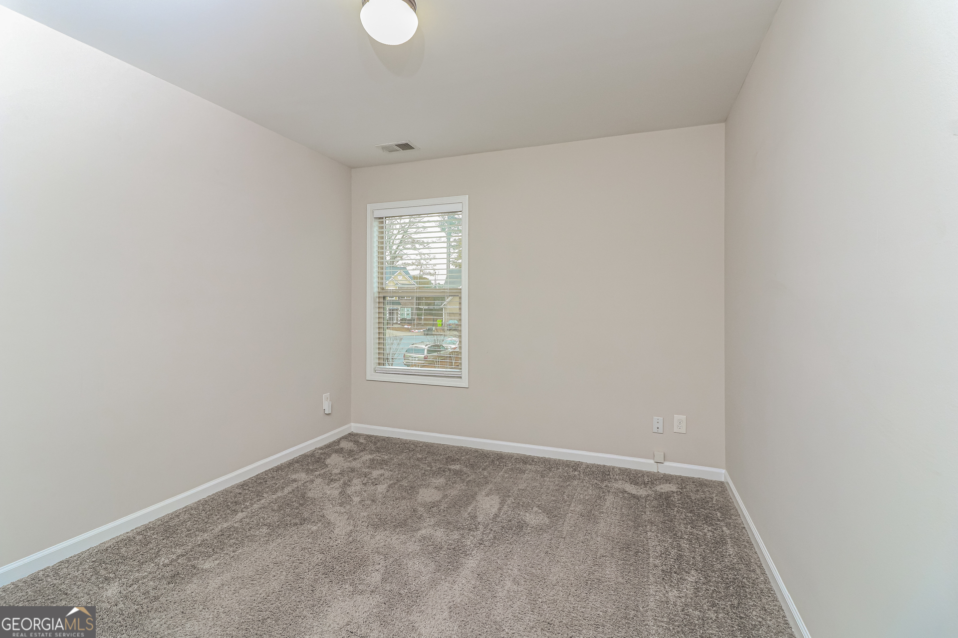 2570 Kolb Manor Circle Southwest Marietta, GA 30008 - Photo 18 of 22 an empty room with windows