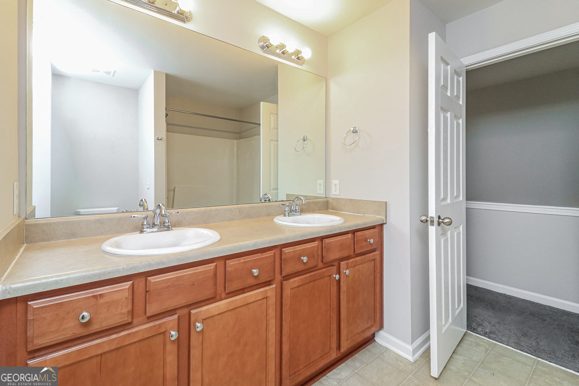2570 Kolb Manor Circle Southwest Marietta, GA 30008 - Photo 19 of 22 a bathroom with a granite countertop sink and a mirror