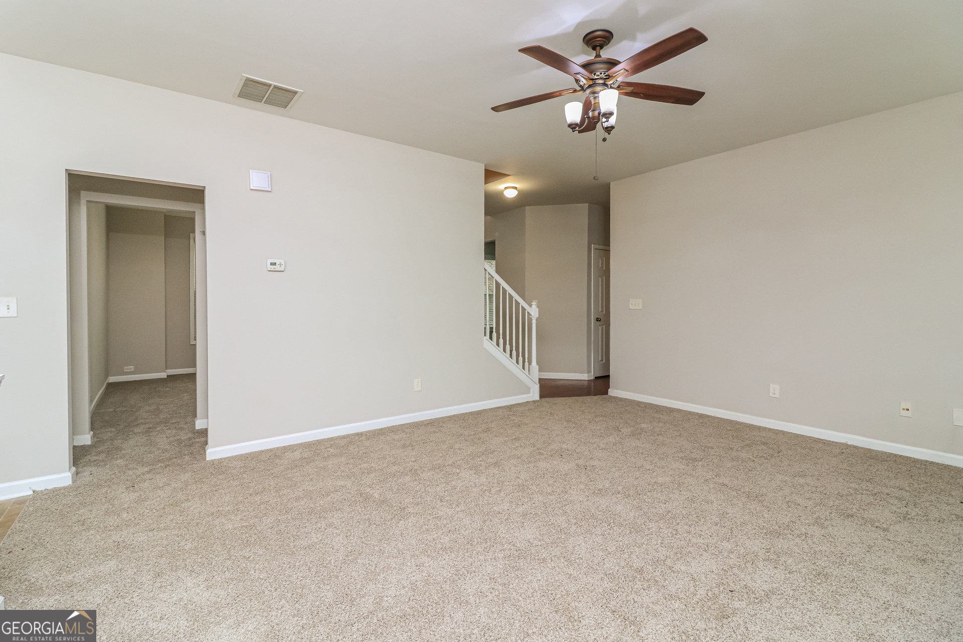 2570 Kolb Manor Circle Southwest Marietta, GA 30008 - Photo 6 of 22 an empty room with closet and a ceiling fan