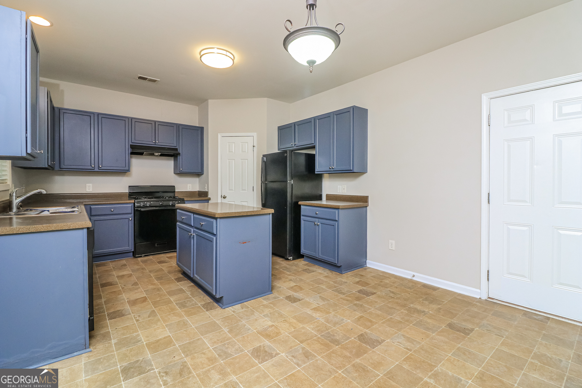 2570 Kolb Manor Circle Southwest Marietta, GA 30008 - Photo 9 of 22 a kitchen with stainless steel appliances granite countertop a stove top oven a sink dishwasher and a refrigerator