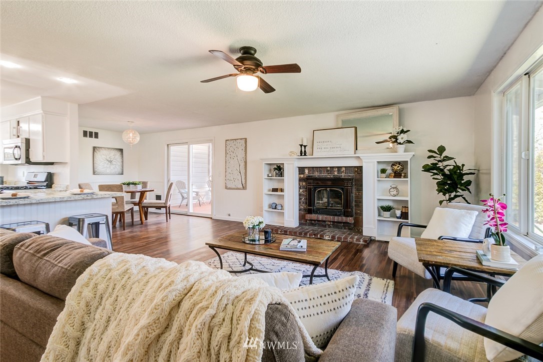 16618 124th Avenue Southeast Renton, WA 98058 - Photo 4 of 21 a living room with furniture and a fireplace