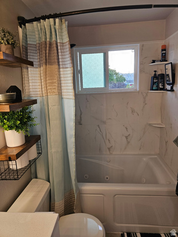 705 North 700 East Payson, UT 84651 - Photo 16 of 30 Full bathroom featuring a combined bath / shower with jetted tub, plenty of natural light, and vanity