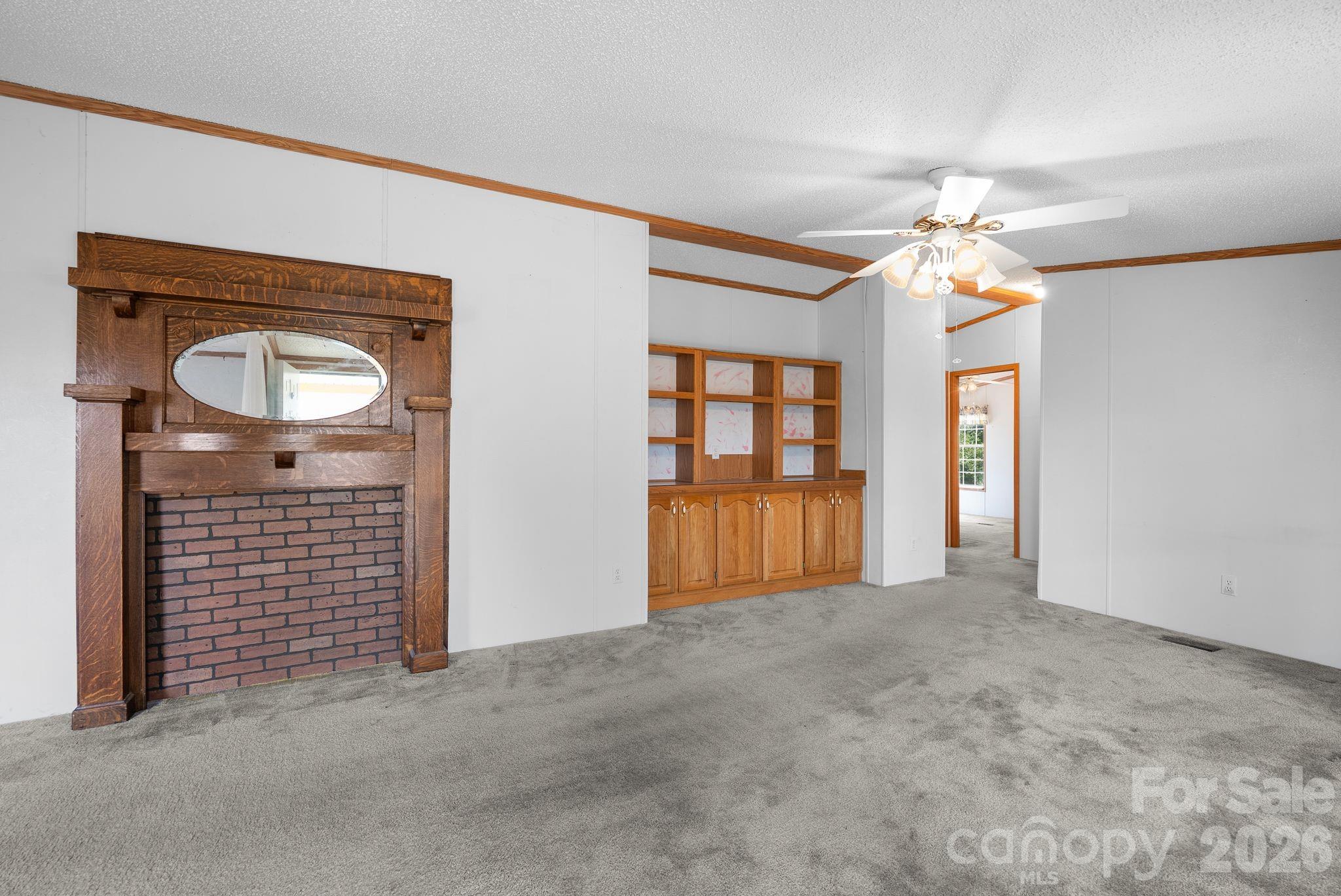 133 Spivey Mountain Road Asheville, NC 28806 - Photo 14 of 40 an empty room with windows and cabinet