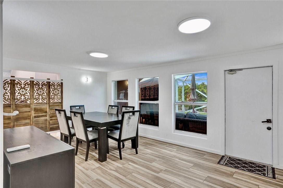 10066 Camelback Lane Boca Raton, FL 33498 - Photo 11 of 34 a view of a dining room with furniture and a window