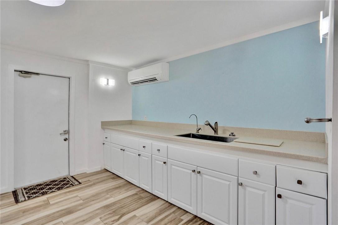 10066 Camelback Lane Boca Raton, FL 33498 - Photo 12 of 34 a kitchen with a sink and cabinets