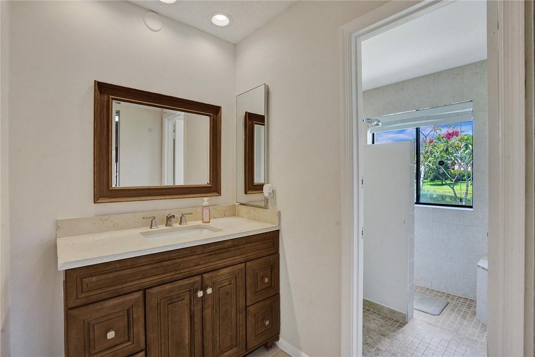 10066 Camelback Lane Boca Raton, FL 33498 - Photo 14 of 34 a bathroom with a sink and a mirror
