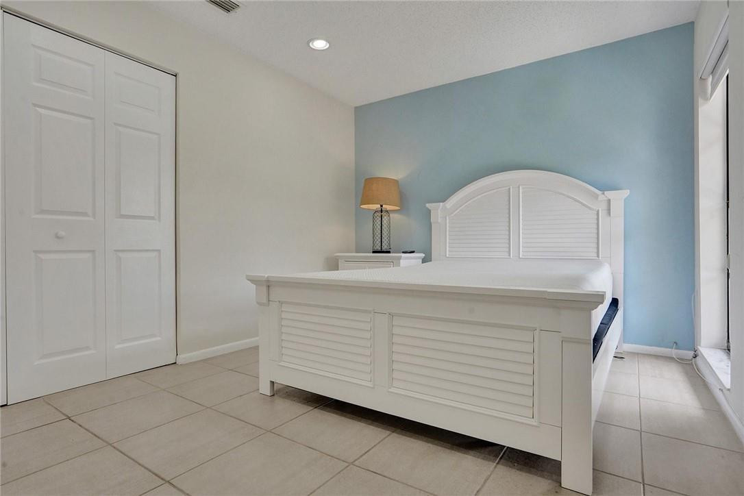 10066 Camelback Lane Boca Raton, FL 33498 - Photo 18 of 34 a bathroom with a sink vanity and a mirror