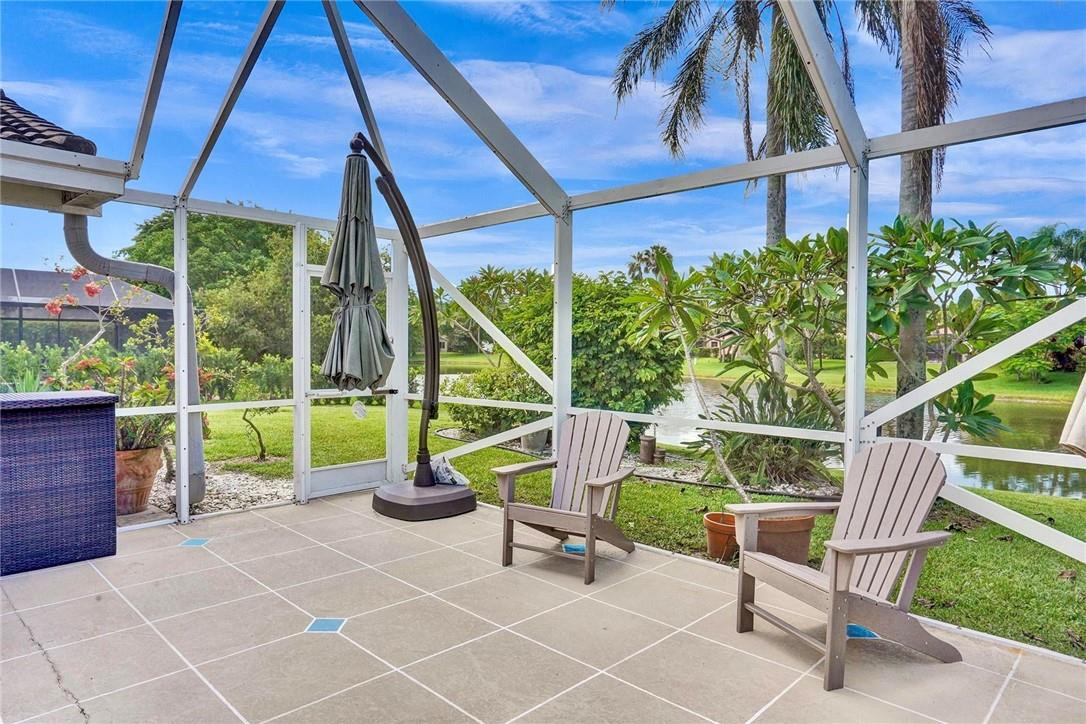 10066 Camelback Lane Boca Raton, FL 33498 - Photo 21 of 34 a view of an chairs and table in the patio