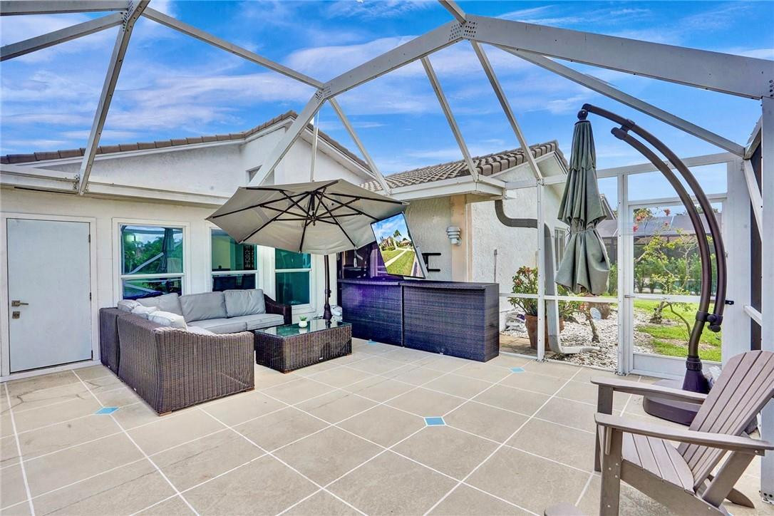10066 Camelback Lane Boca Raton, FL 33498 - Photo 23 of 34 a view of a patio with couches and potted plants