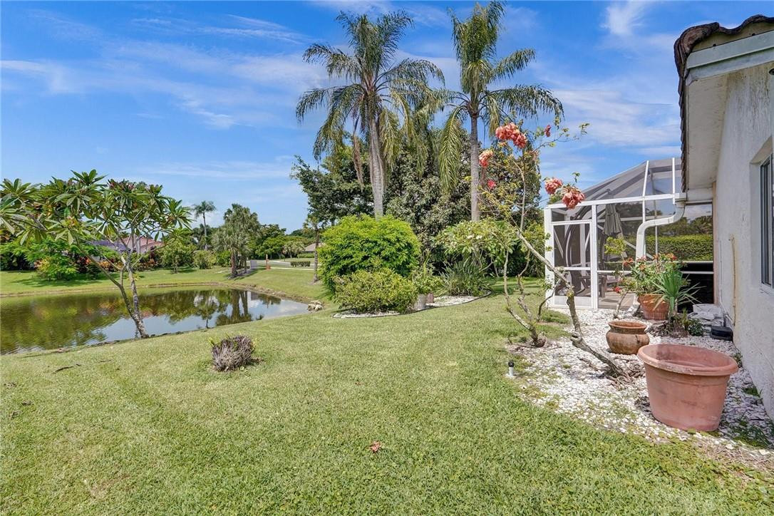 10066 Camelback Lane Boca Raton, FL 33498 - Photo 25 of 34 a view of a backyard with plants and lake view