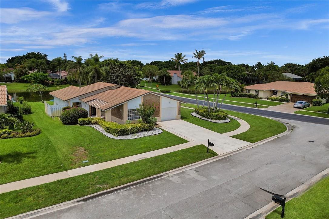 10066 Camelback Lane Boca Raton, FL 33498 - Photo 30 of 34 an aerial view of a house with garden space and street view