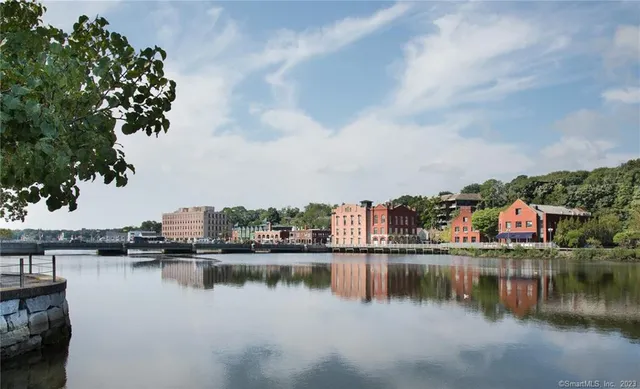 a view of houses with swimming pool and lawn chairs