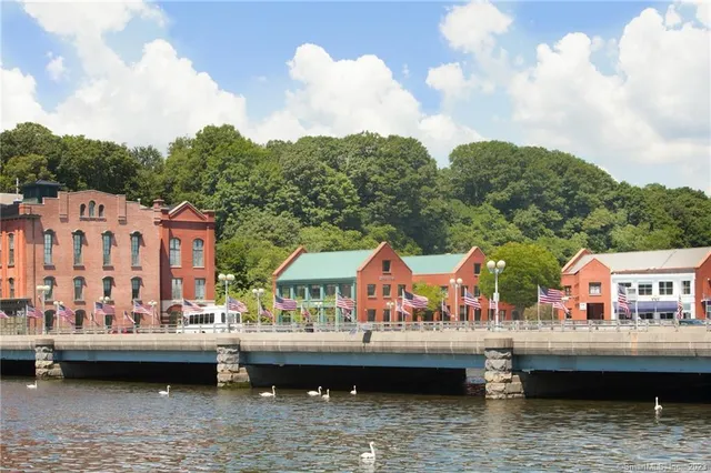 a kitchen with a stove and a chandelier
