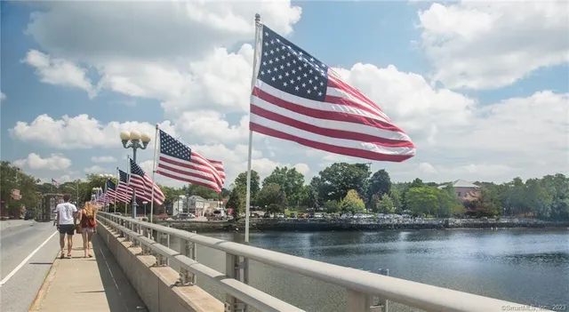 a view of a swimming pool and an outdoor seating