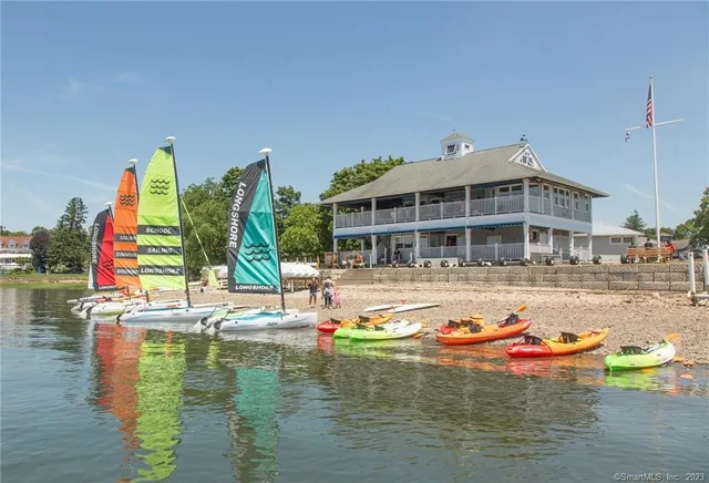 a view of a lake with outdoor seating space