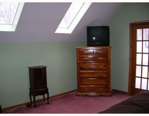 166 Redwood Road Acme, PA 15610 - Photo 5 of 16 Master Bedroom. Skylights and Deck to views