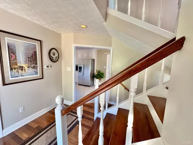 a bedroom with a bed and a television