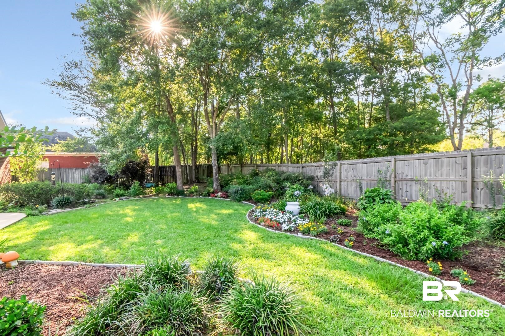 8520 Gayla Court Mobile, AL 36695 - Photo 37 of 40 Expansive backyard with manicured lawn, established perimeter landscaping, and a wood privacy fence