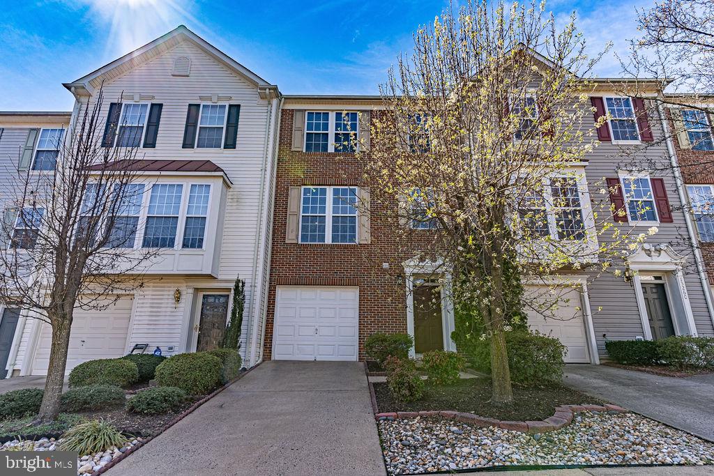 13262 Revillo Loop Woodbridge, VA 22191 - Photo 1 of 32 Charming townhome with vibrant curb appeal.