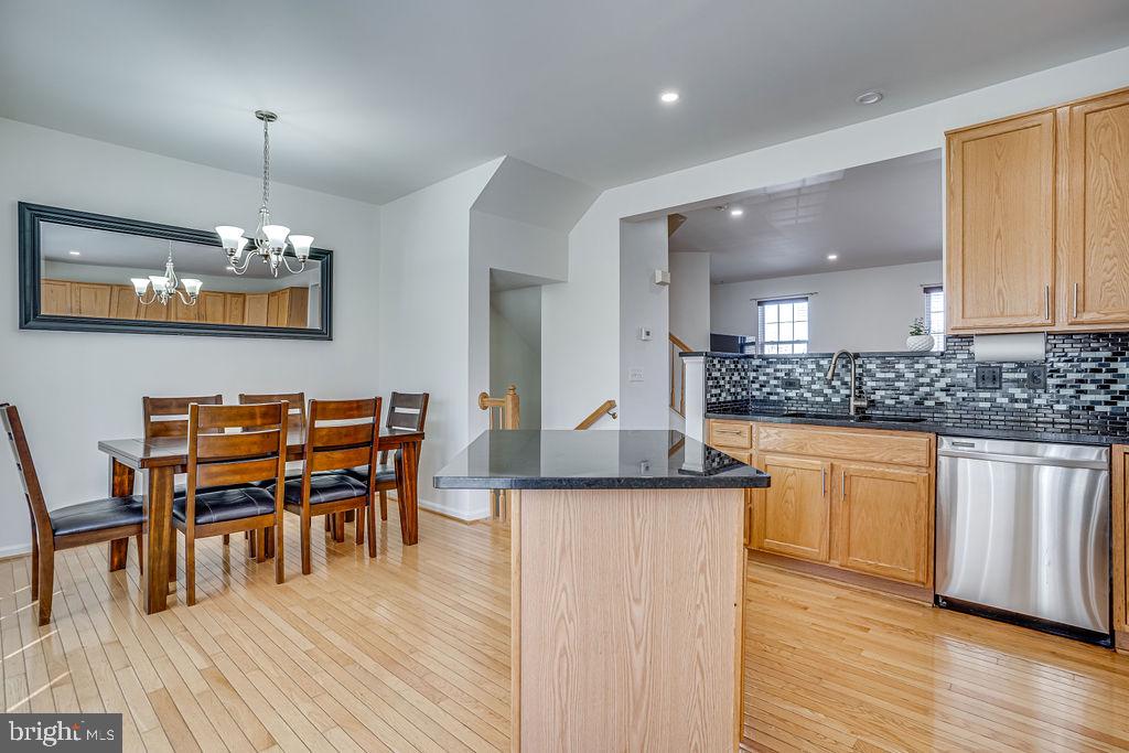 13262 Revillo Loop Woodbridge, VA 22191 - Photo 12 of 32 Modern kitchen with elegant dining area.