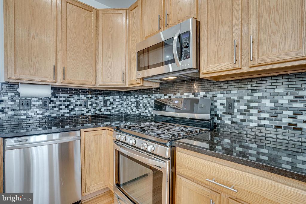 13262 Revillo Loop Woodbridge, VA 22191 - Photo 13 of 32 Sleek kitchen with modern finishes.