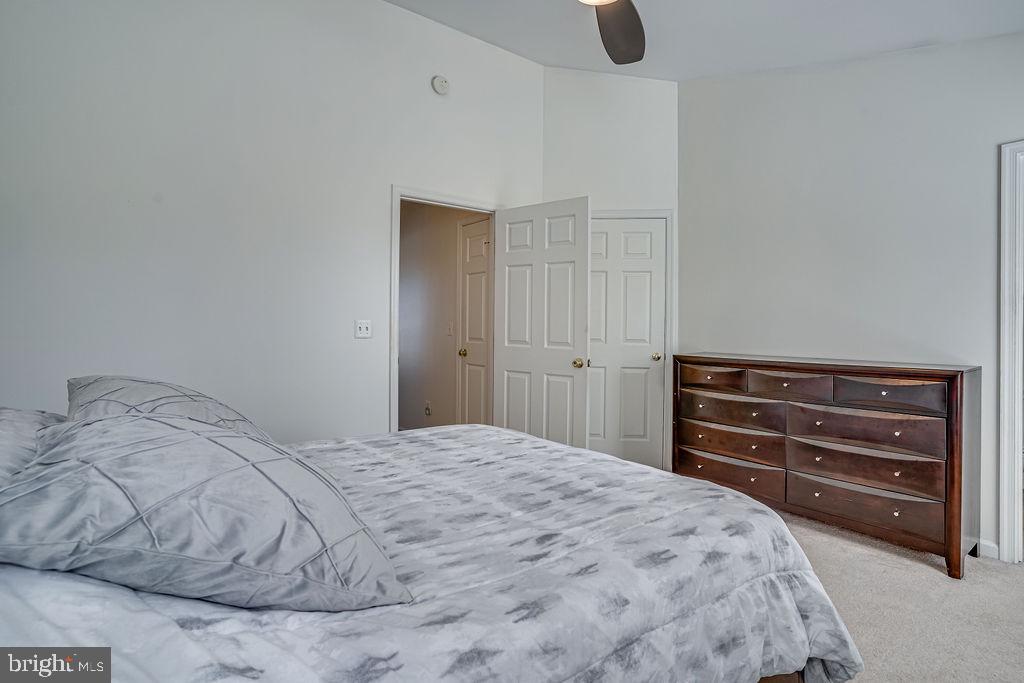 13262 Revillo Loop Woodbridge, VA 22191 - Photo 22 of 32 Serene bedroom with modern elegance.