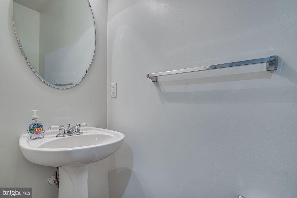 13262 Revillo Loop Woodbridge, VA 22191 - Photo 27 of 32 Sleek and modern bathroom elegance.