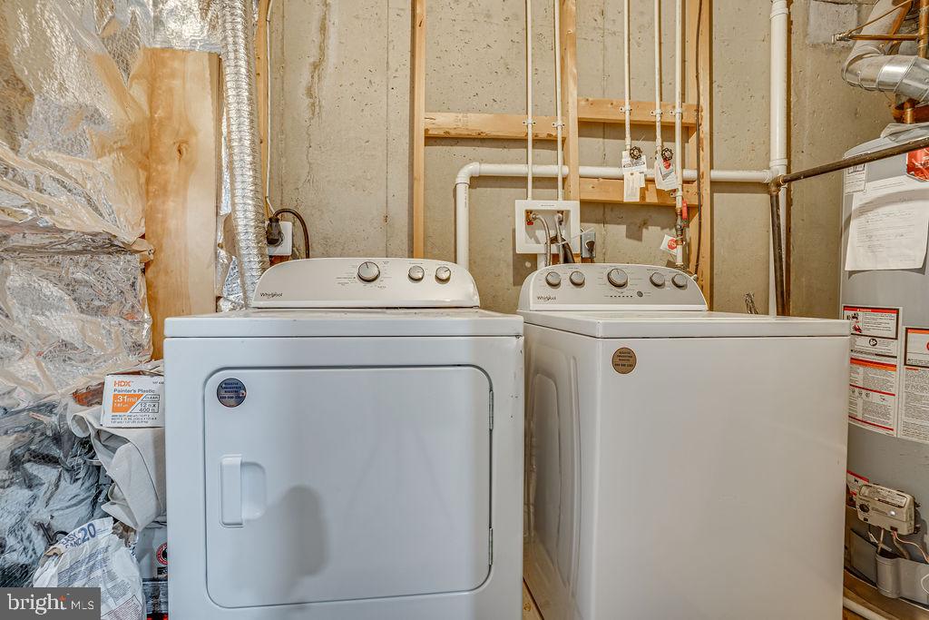 13262 Revillo Loop Woodbridge, VA 22191 - Photo 28 of 32 Modern laundry appliances in utility space.