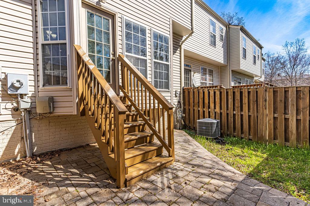 13262 Revillo Loop Woodbridge, VA 22191 - Photo 30 of 32 Charming backyard with wooden steps.