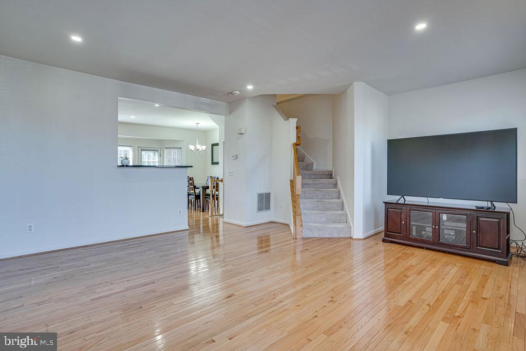 13262 Revillo Loop Woodbridge, VA 22191 - Photo 4 of 32 Spacious living area with warm tones.