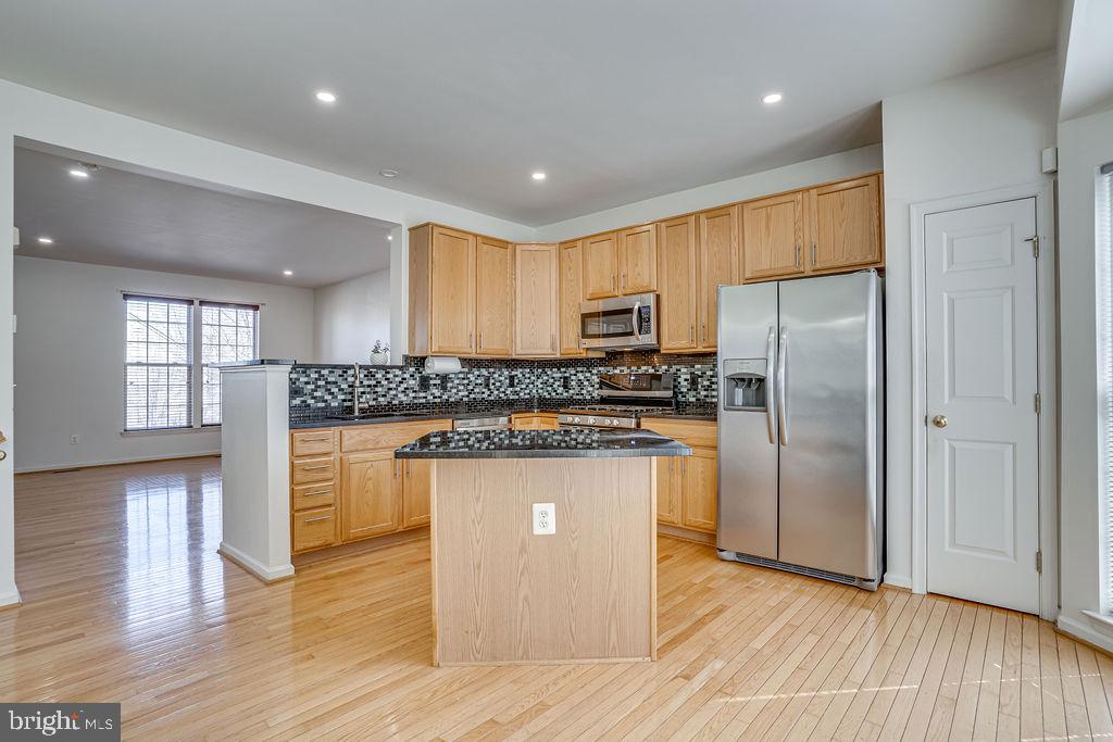 13262 Revillo Loop Woodbridge, VA 22191 - Photo 8 of 32 Modern kitchen with sleek finishes.